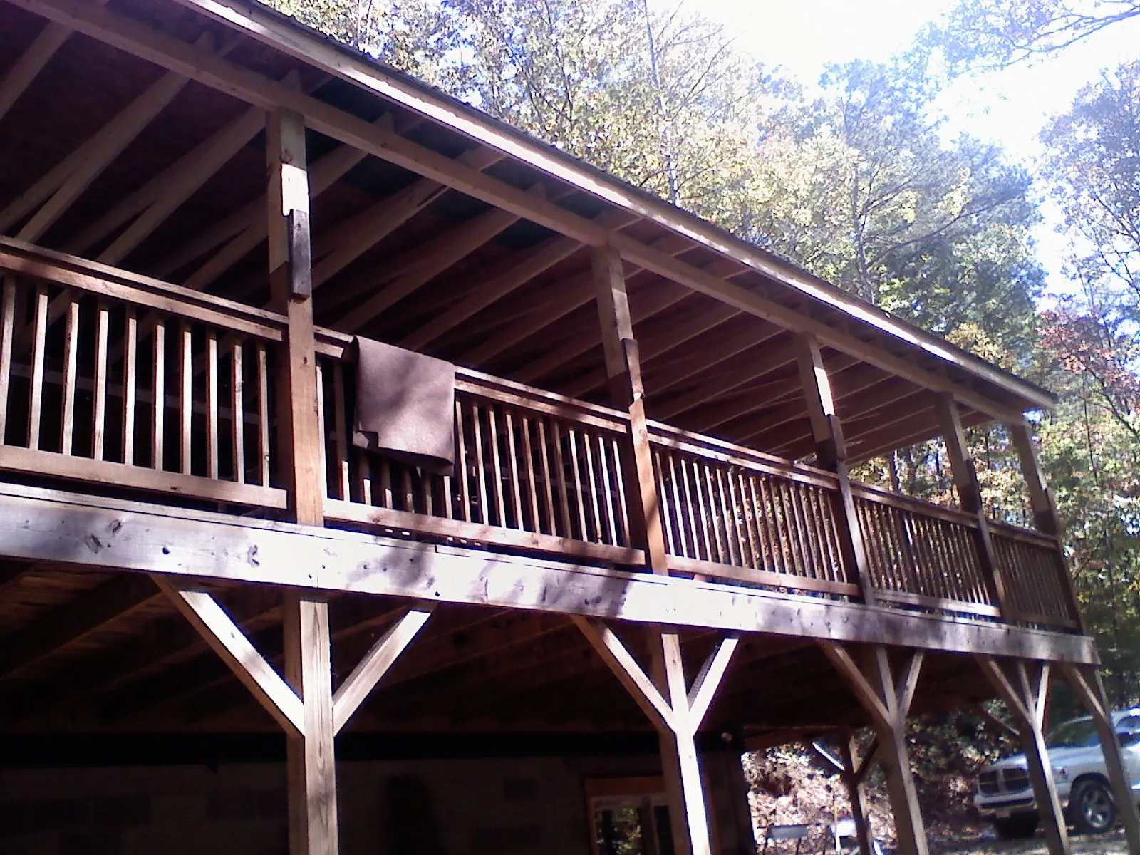 Timber framing under a new elevated porch and deck — Roof Leak Repair in Maple by Roofing Brothers